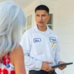 hvac service technician talking to customer
