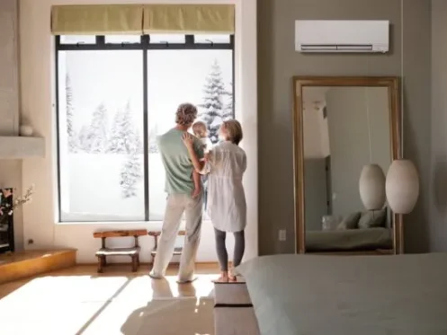 Family enjoying warm home during winter