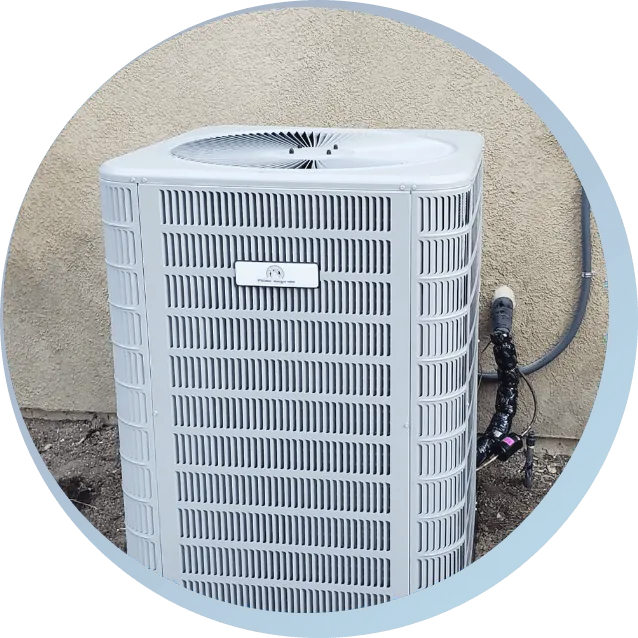 Newly installed outdoor air conditioning unit mounted beside a beige stucco wall with visible conduit and refrigerant lines.