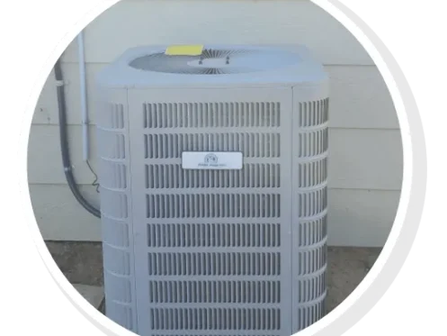 New outdoor AC condenser unit installed against wall