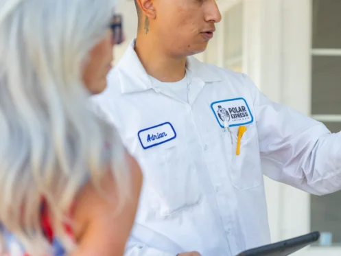 Polar Express technician discussing service with customer
